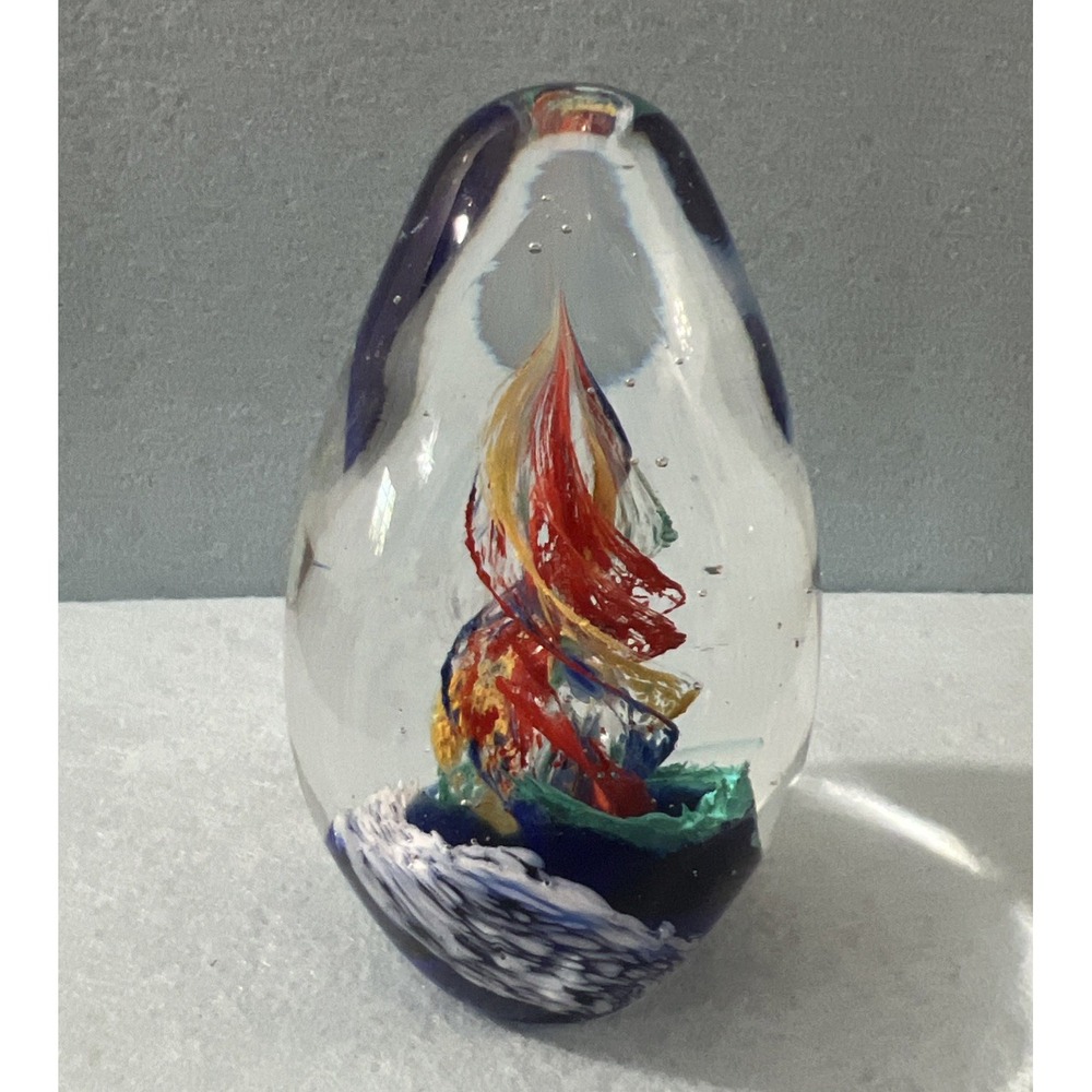 Egg Shaped Paperweight with spirals of bright Colored Glass